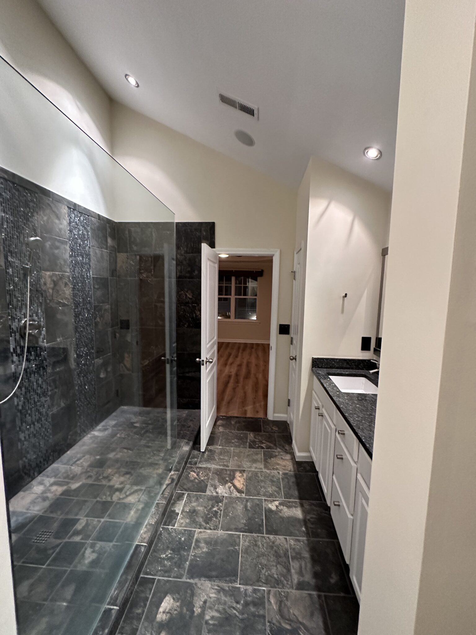 Porcelain tile installation in Charlotte bathroom with decorative wall finish